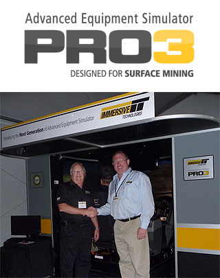 Ken Edwards, Caterpillar Health, Safety and Environmental Manager for mining with Gerrit Zevenster, Immersive Technologies Regional Manager Africa in front of the PRO3 simulator for surface mining.
