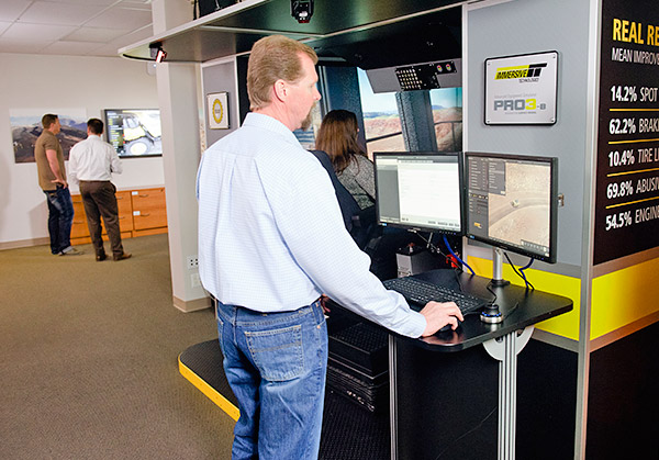 Staff using trainer station to review training improvements on Immersive Technologies PRO3 Simulator