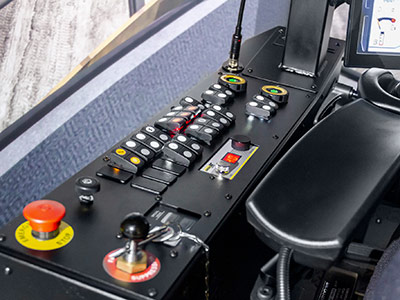 Cat 6060 - Left Console with OEM switches for critical functions.